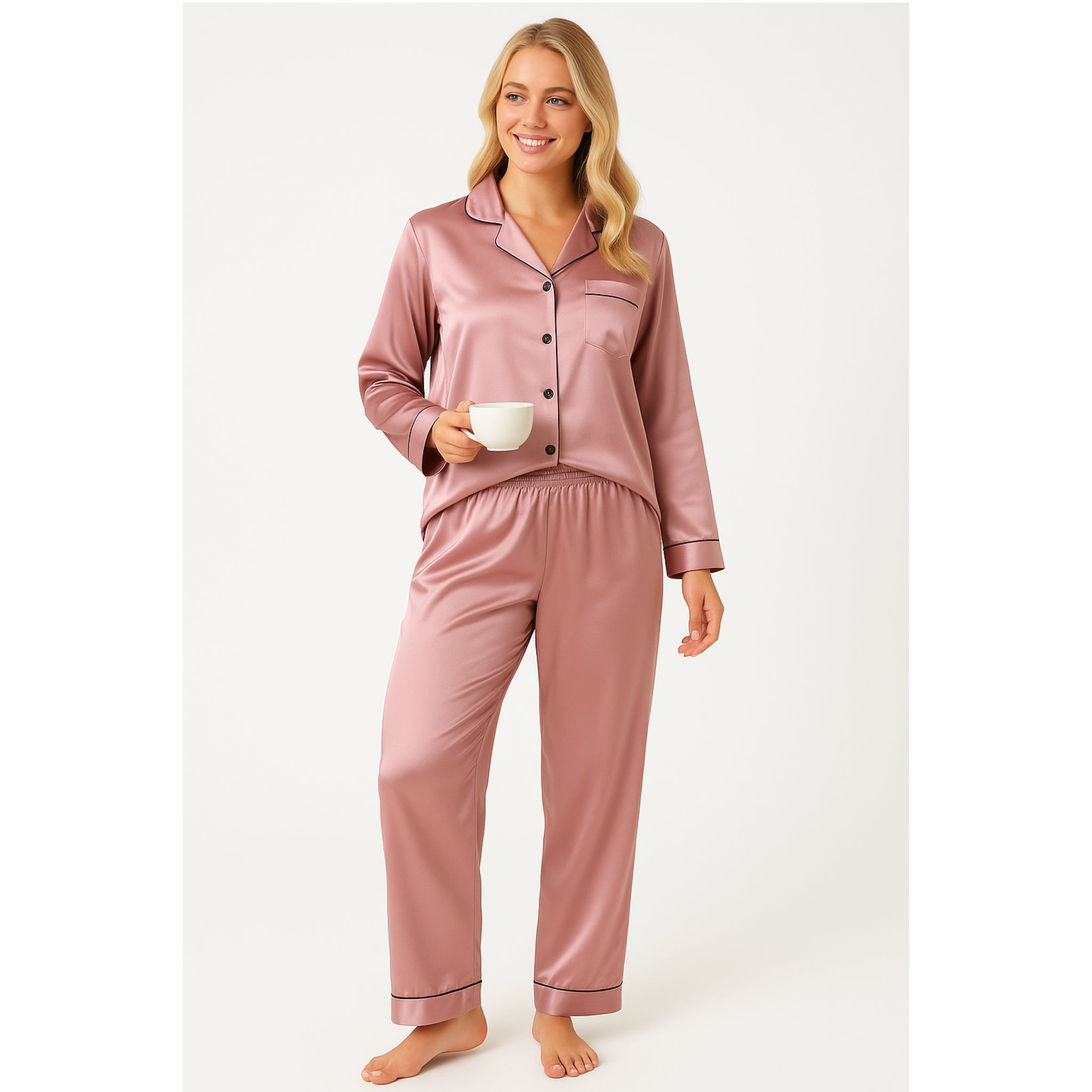Women's soft silky touch satin pyjama set in rose pink with black piping, long sleeve button-up top and matching full-length trousers, comfortable nightwear